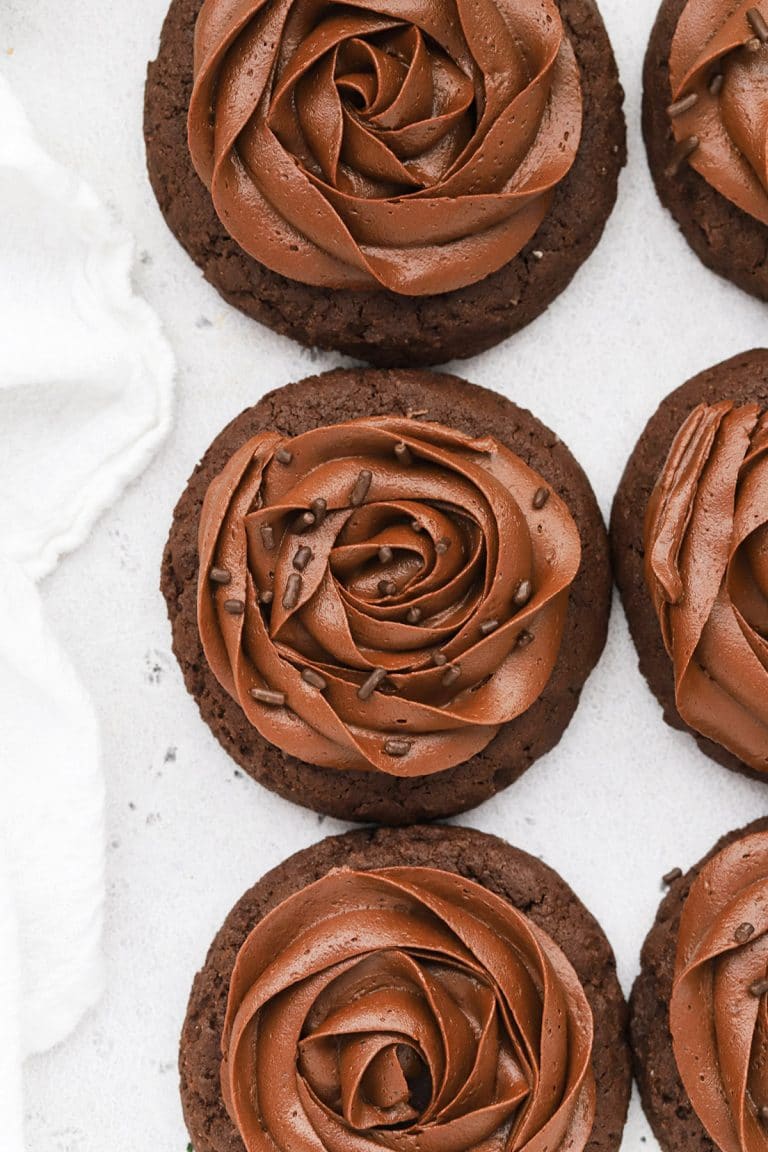 Overhead view of gluten-free Crumbl chocolate cake cookies with chocolate frosting