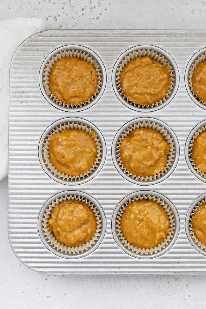 Overhead view of gluten-free pumpkin cupcakes ready to be baked