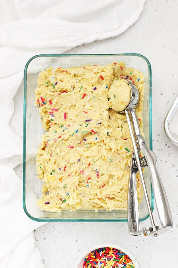 Chilled gluten-free sprinkle sugar cookie dough ready to be scooped into balls