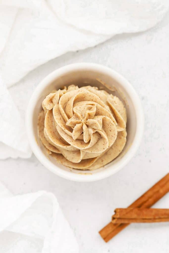 Overhead view of Whipped Cinnamon Butter Piped into a small white bowl in a pretty design
