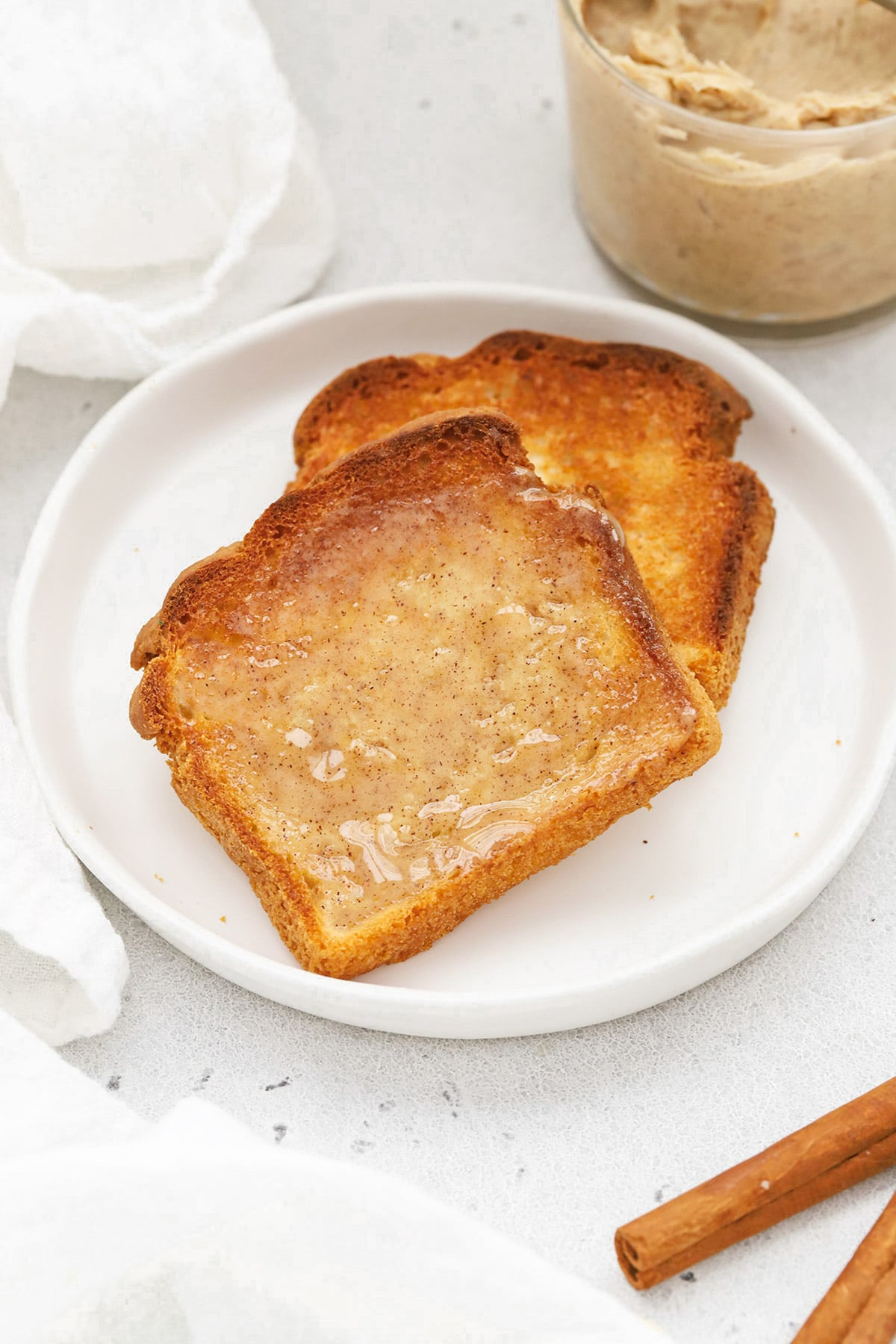 Front view of two slices of gluten-free toast topped with whipped cinnamon butter