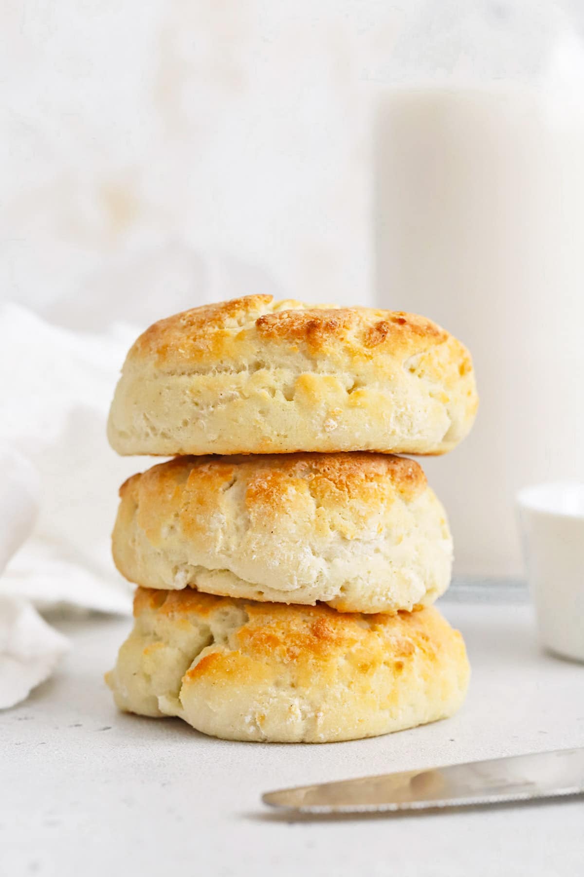 A stack of three fluffy gluten-free biscuits