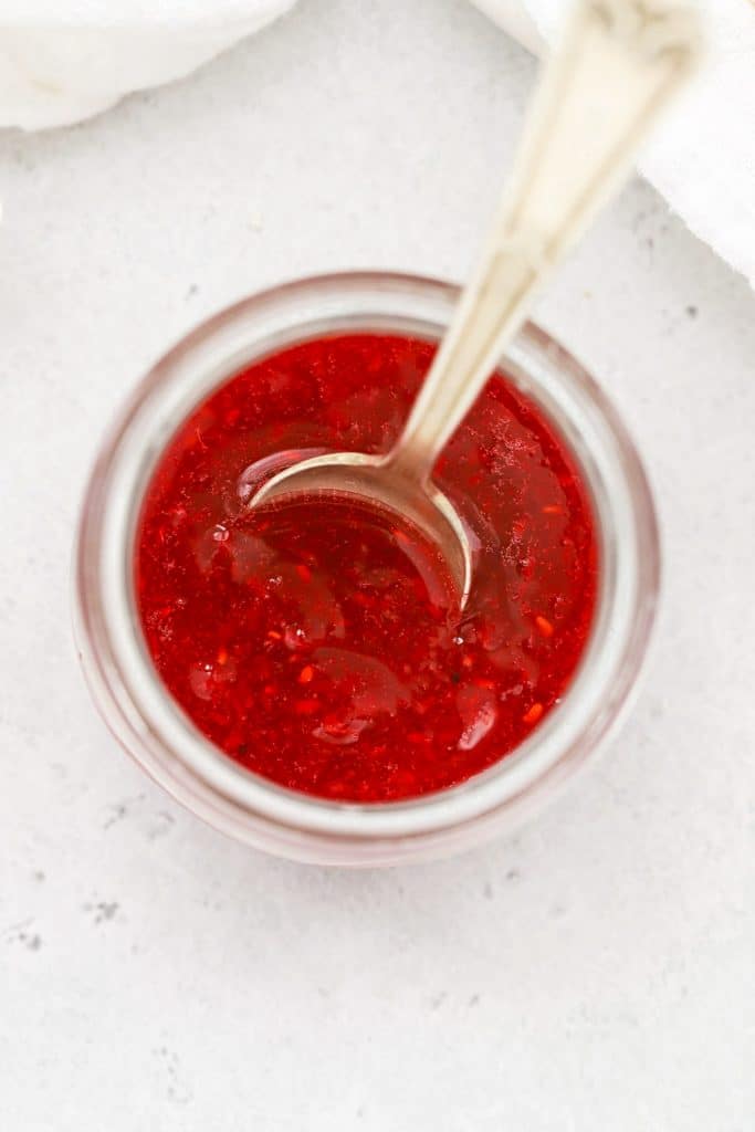 Overhead view of raspberry freezer jam in a jar