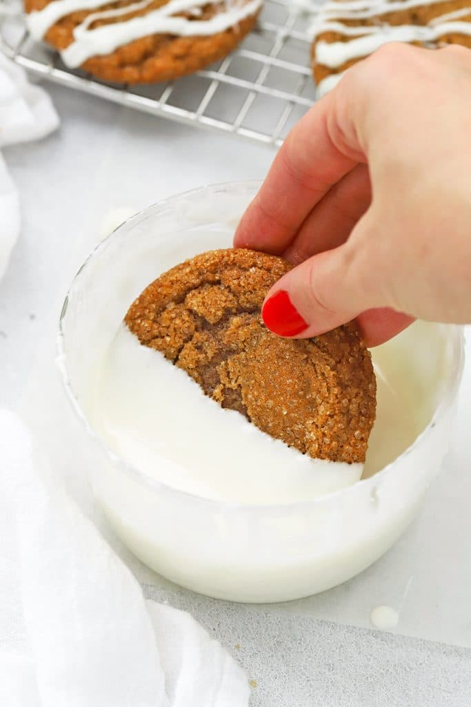 Dipping a soft ginger cookie in white chocolate