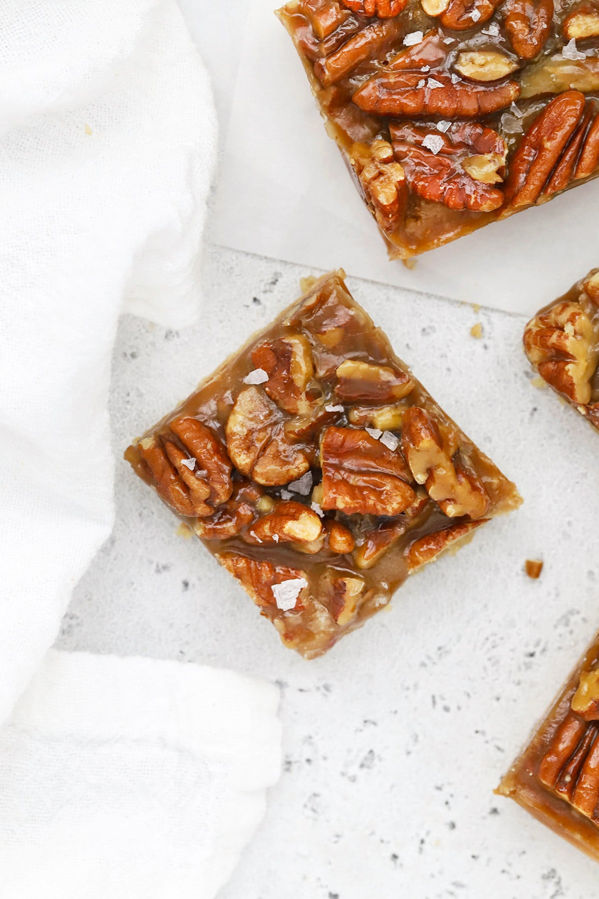 Overhead view of gluten-free salted caramel pecan bars cut into squares