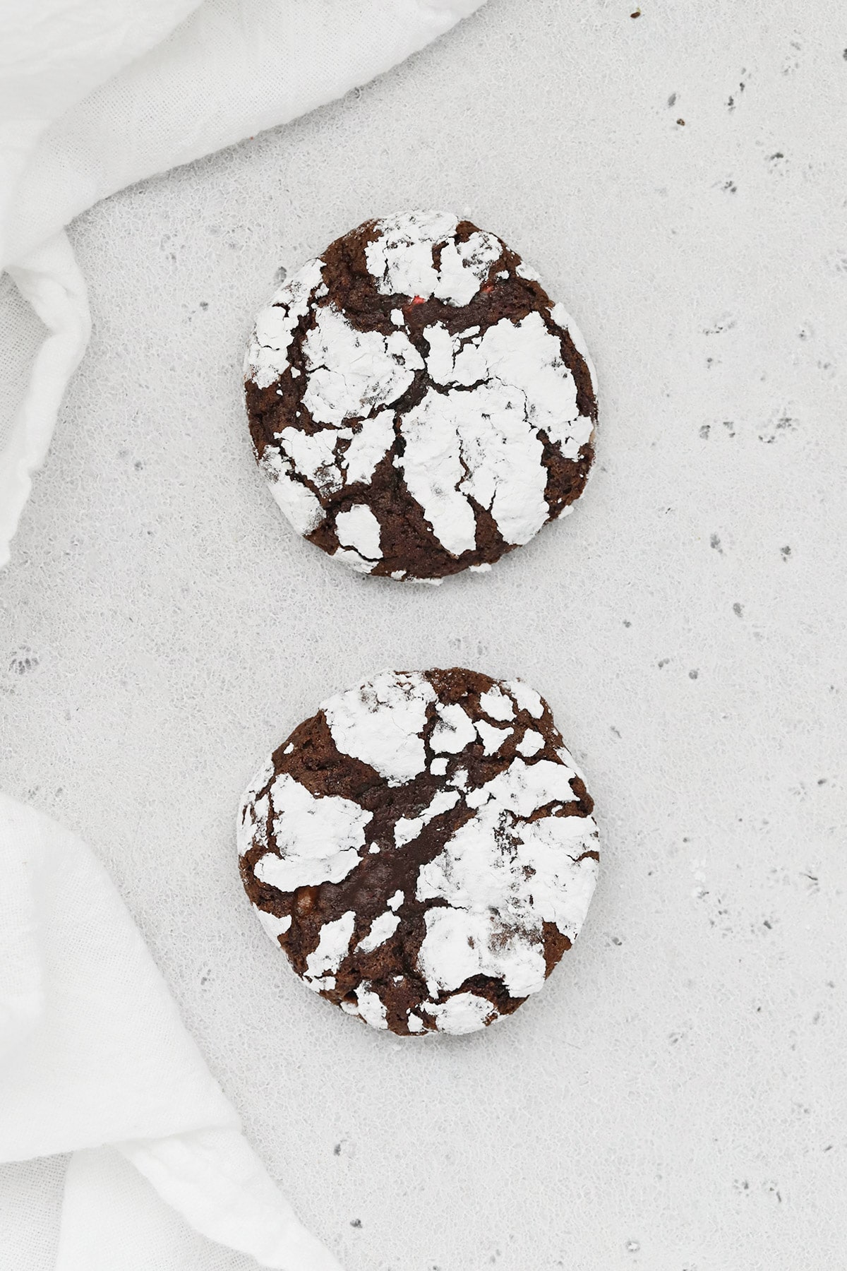 Two gluten-free peppermint chocolate crinkle cookies