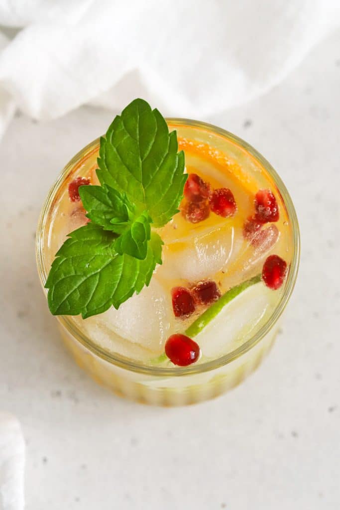 Overhead view of Citrus Orange Mocktails With Mint, Pomegranate and Citrus Slices