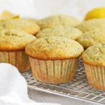 Front view of gluten-free lemon poppy seed muffins cooling on a cooling rack