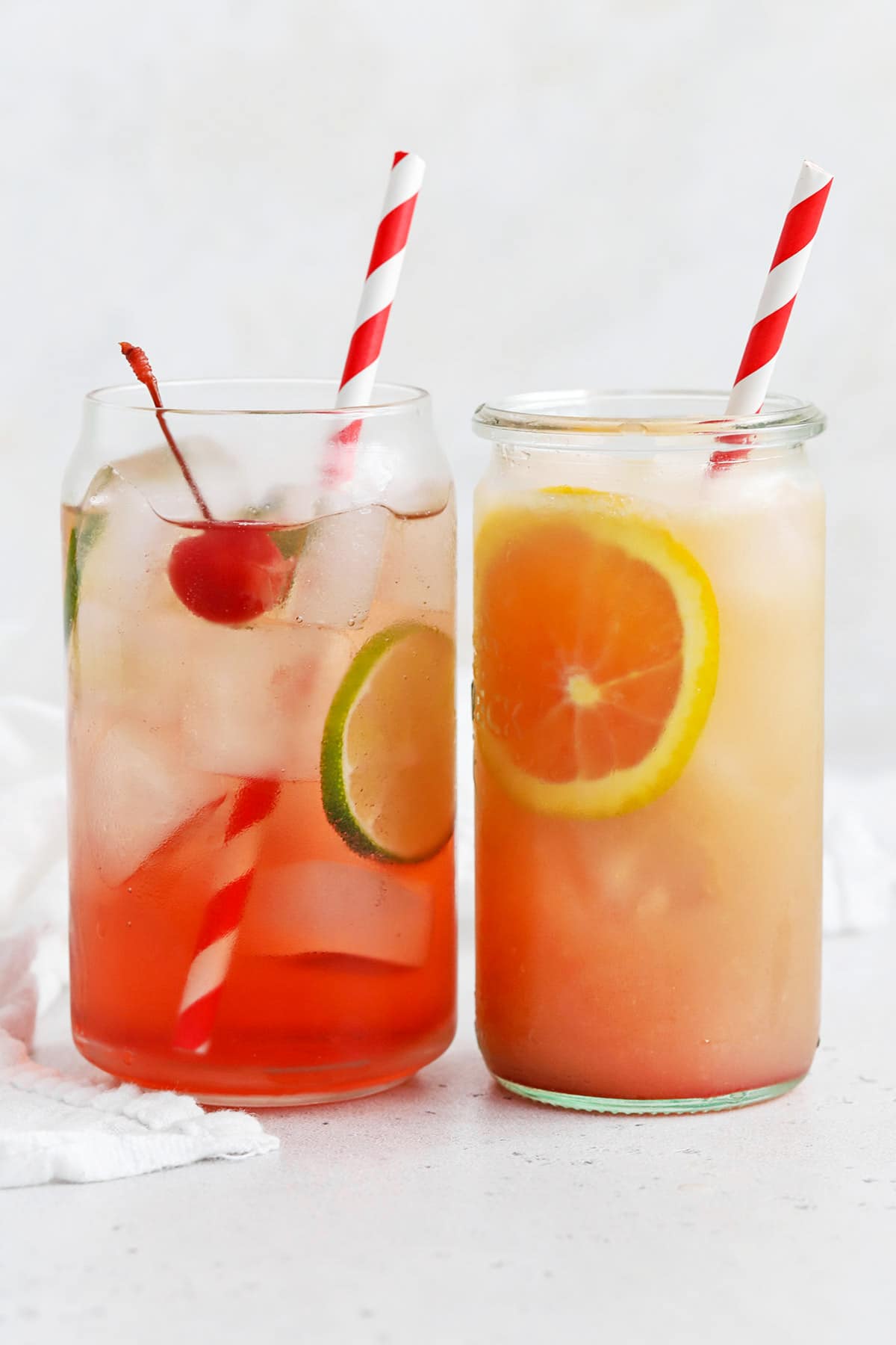 Two mocktails made with grenadine - a Shirley Temple and sweetheart sunrise