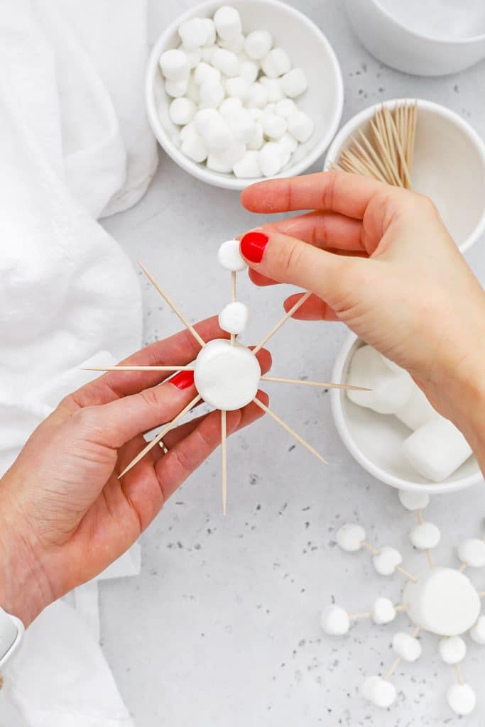 Overhead view of how to make marshmallow snowflakes
