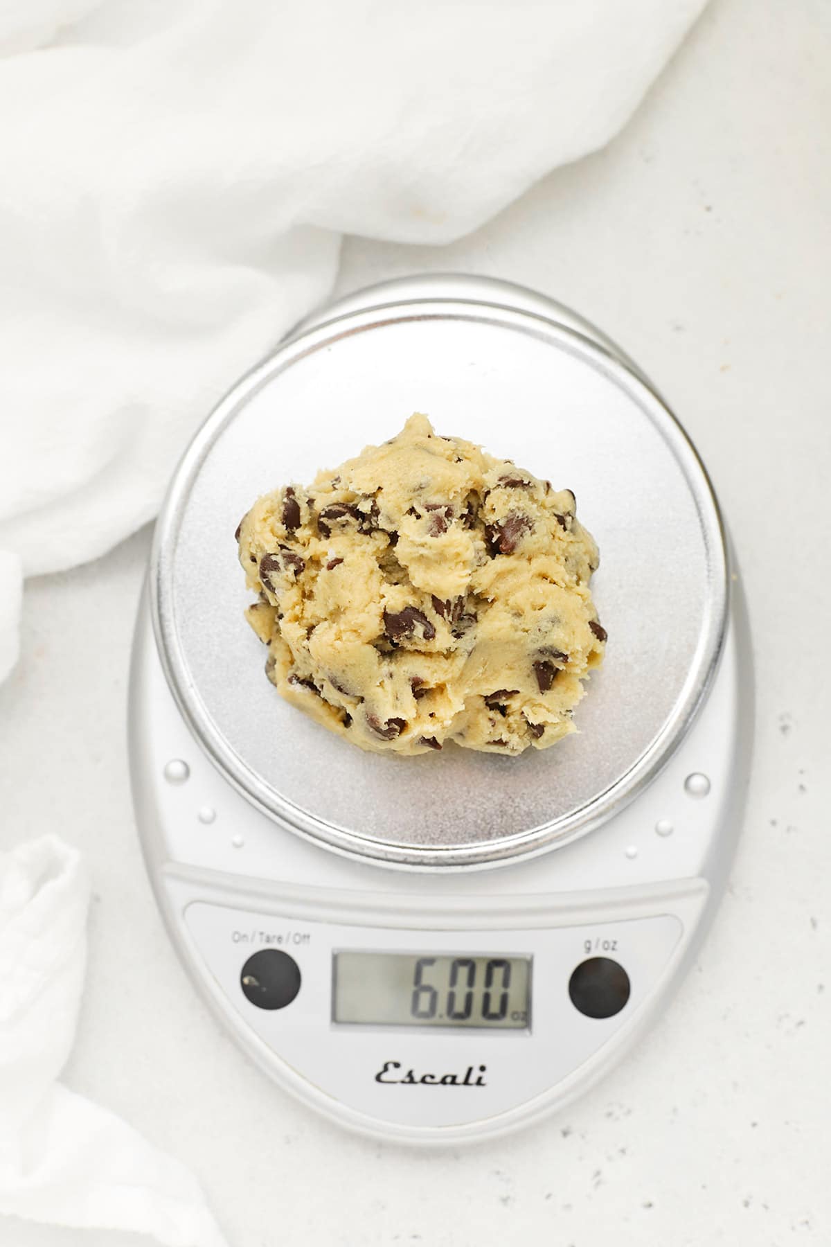 Weighing 6 oz. of dough to make thick Levain gluten-free chocolate chip cookies