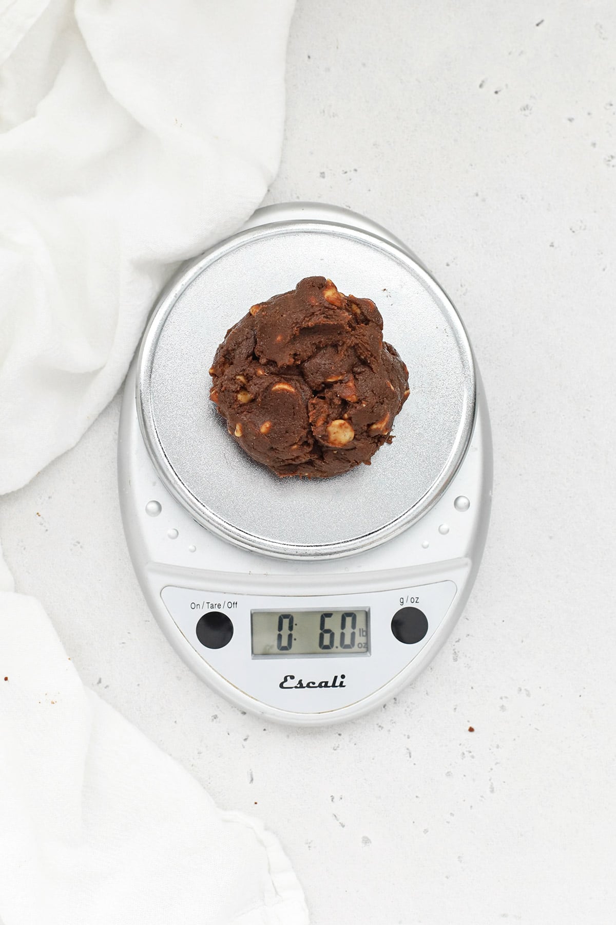 Weighing chocolate peanut butter chip cookie dough