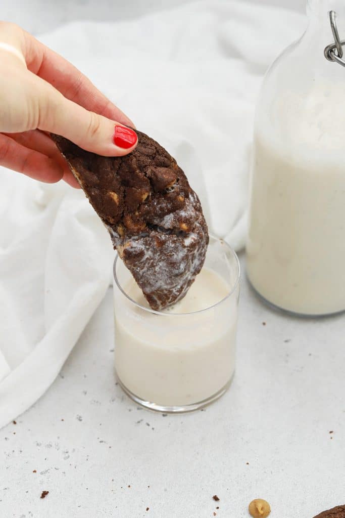 Dipping a gluten-free chocolate peanut butter chip cookie in almond milk