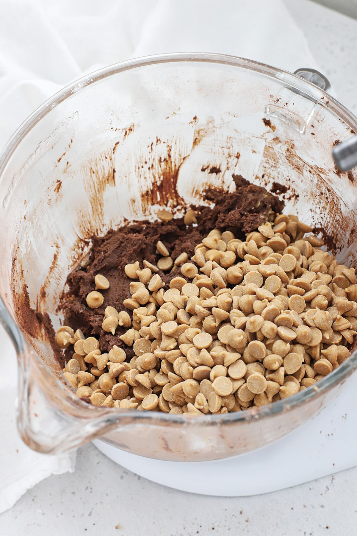 Adding peanut butter chips to gluten-free levain chocolate peanut butter chip cookies dough