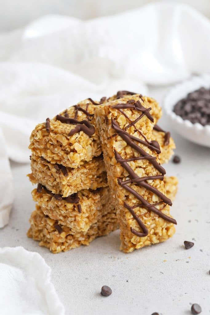 Front view of healthy peanut butter granola bars drizzled with chocolate