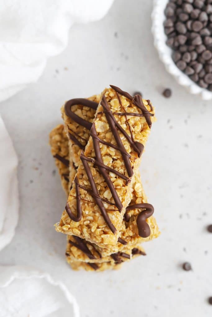 Overhead view of healthy peanut butter granola bars drizzled with chocolate