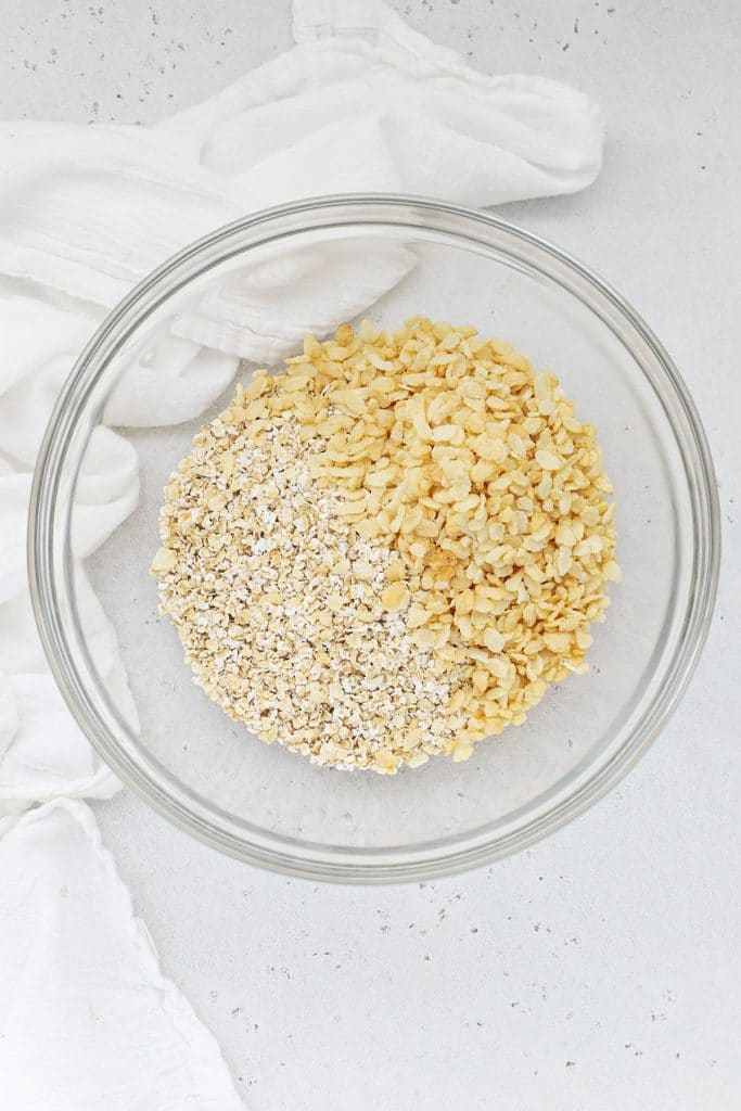 Mixing gluten-free oats and brown rice cereal to make healthy peanut butter granola bars