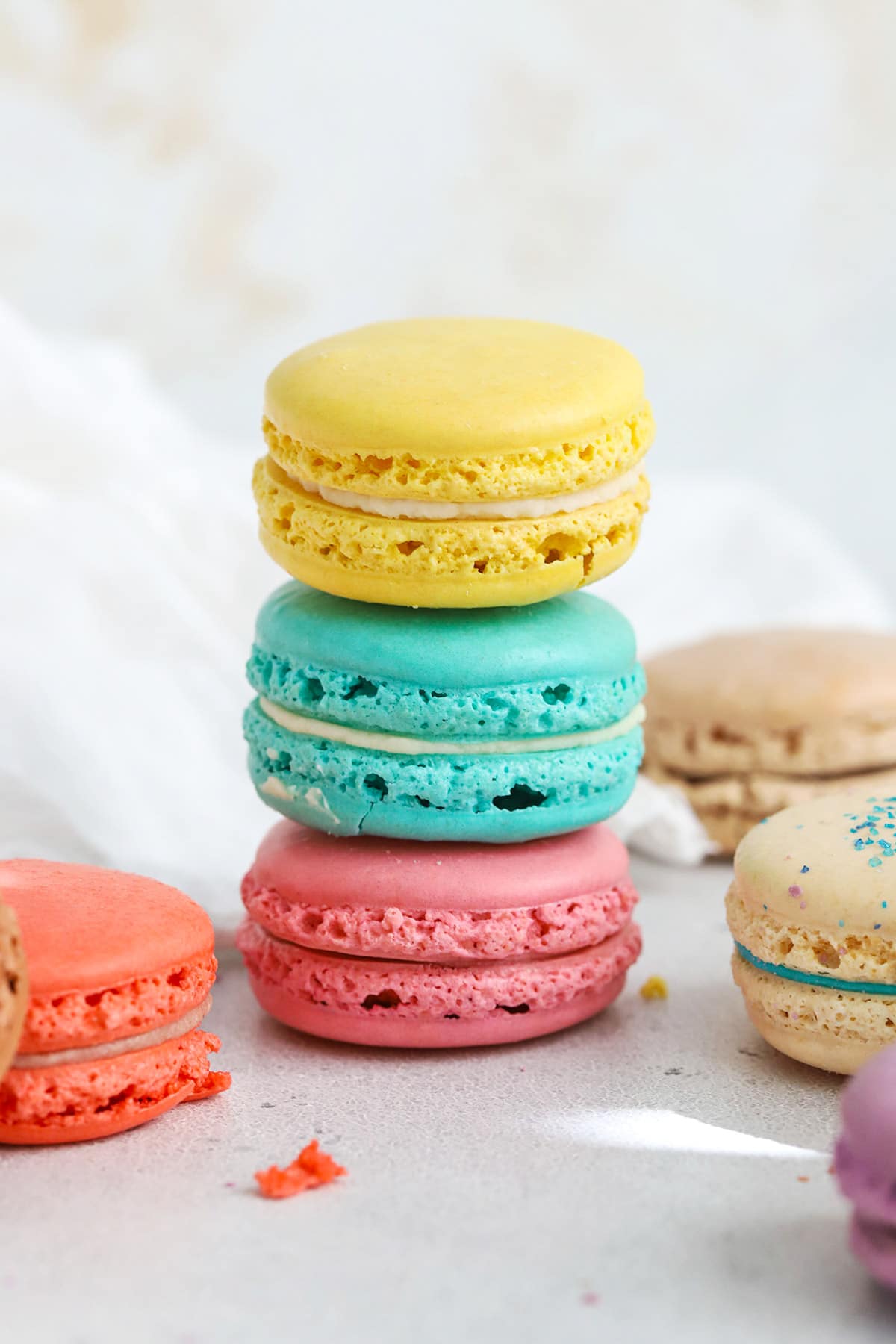 Front view of colorful macarons made with whipped egg whties