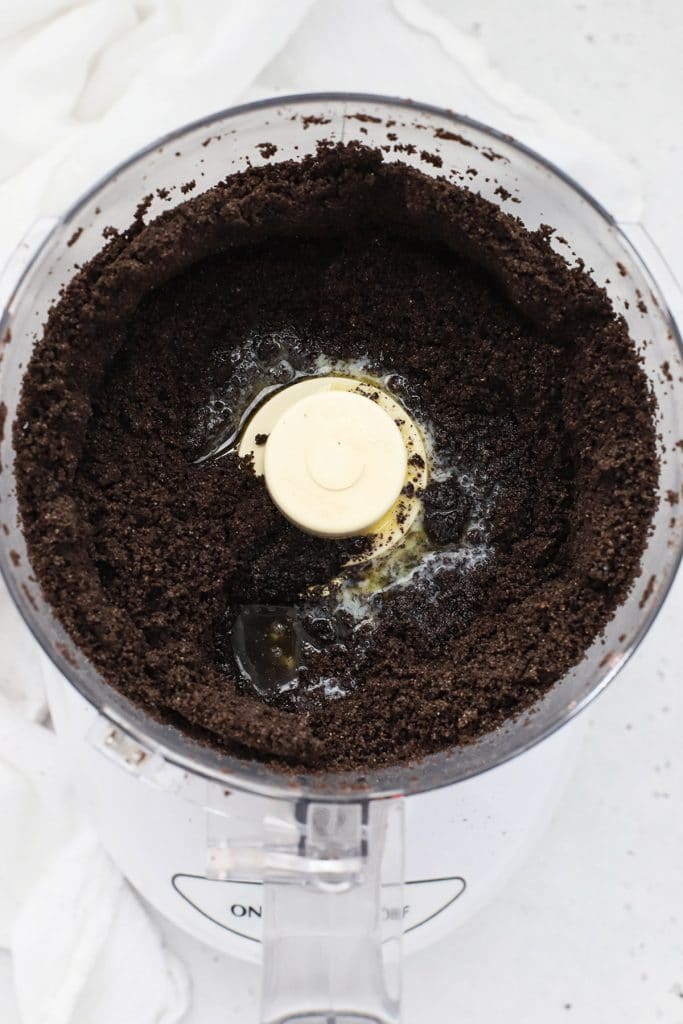 Gluten-free oreos mixed with melted butter to make gluten-free chocolate crust