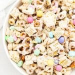 Large bowl of bunny bait easter chex mix with pastel m&ms, gluten-free pretzels, and Chex cereal