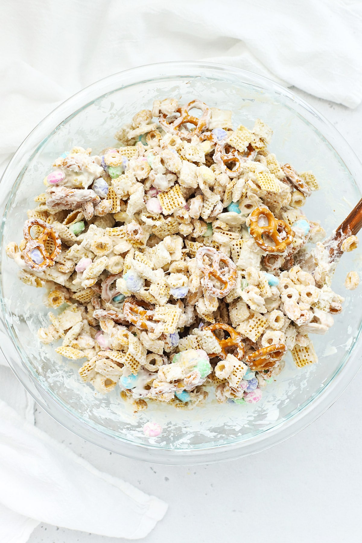 Mixing white chocolate into gluten-free bunny bait chex mix