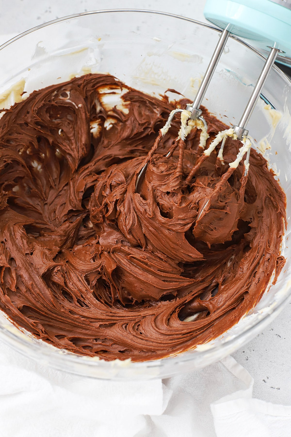 whipping chocolate into gluten-free chocolate cheesecake filling