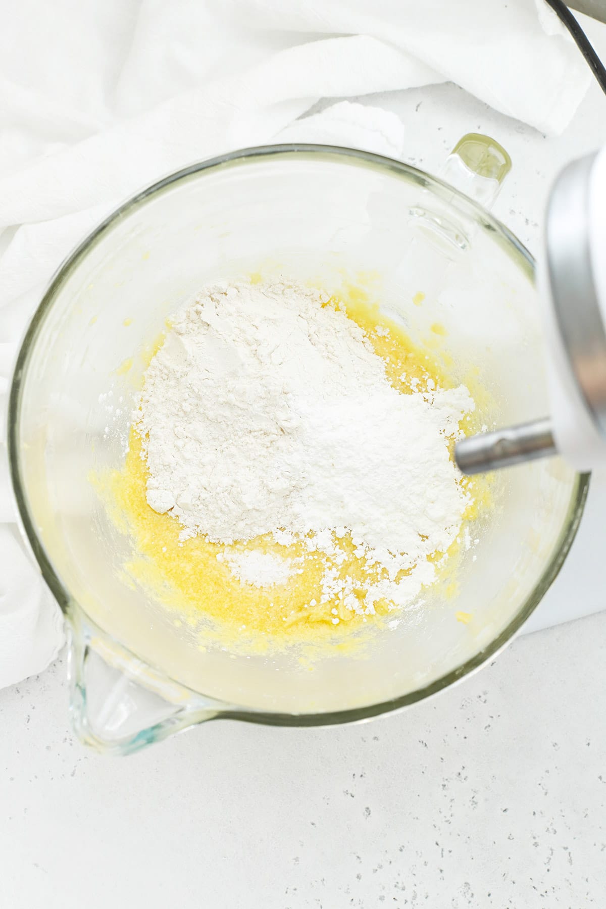 Adding dry ingredients to gluten-free lemon brownie batter