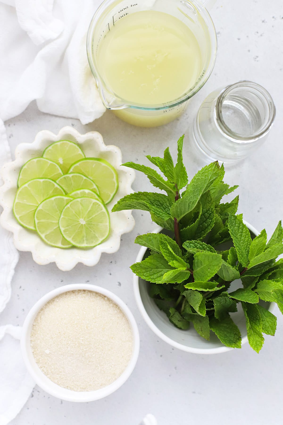 Overhead view of ingredients for virgin mojitos mint limeade