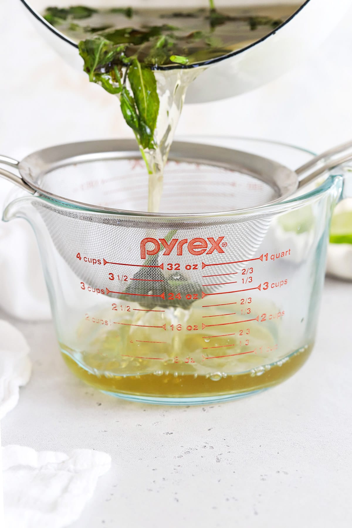 Straining mint simple syrup