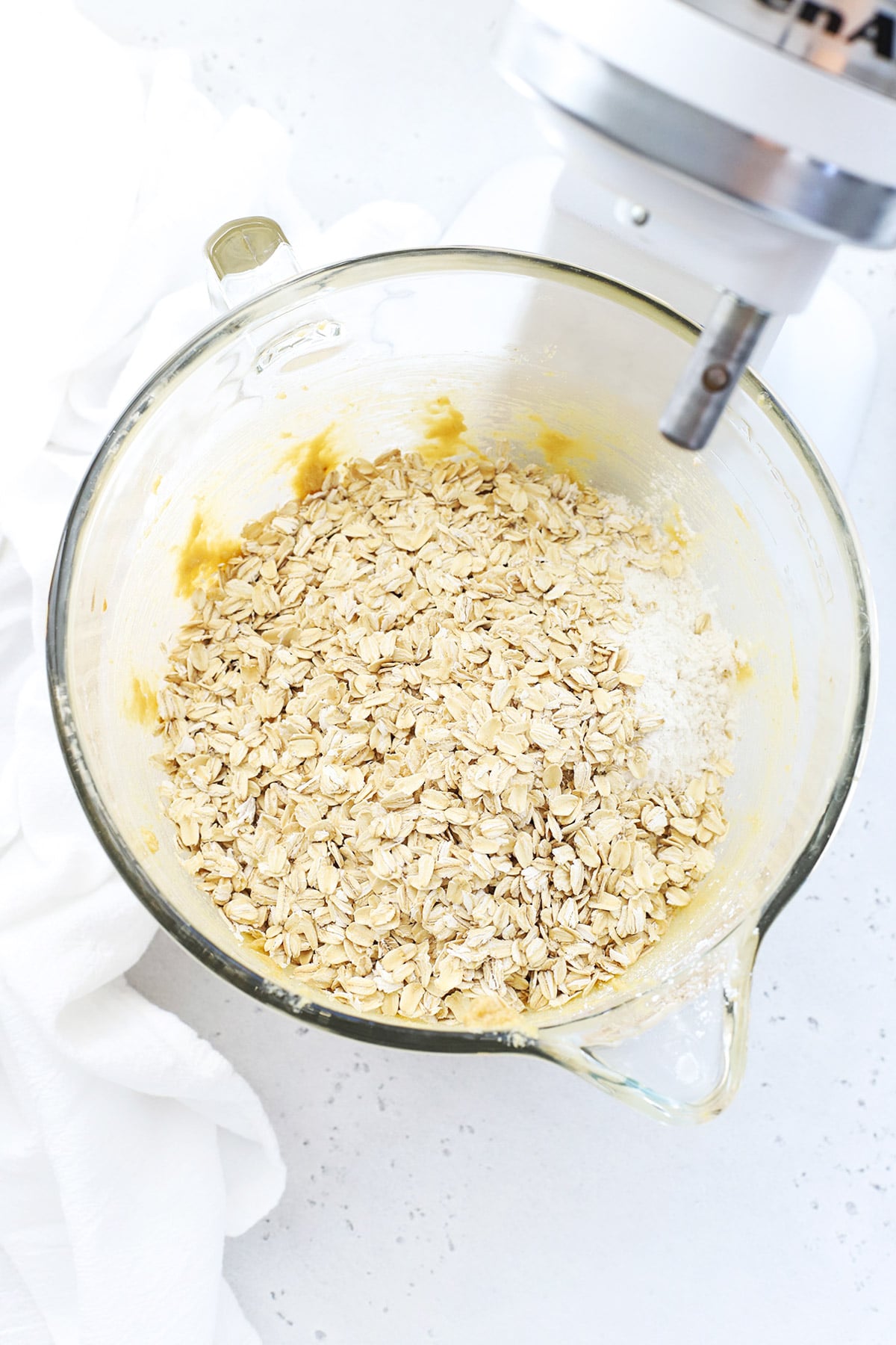 adding oats to gluten-free butterscotch oatmeal cookie dough