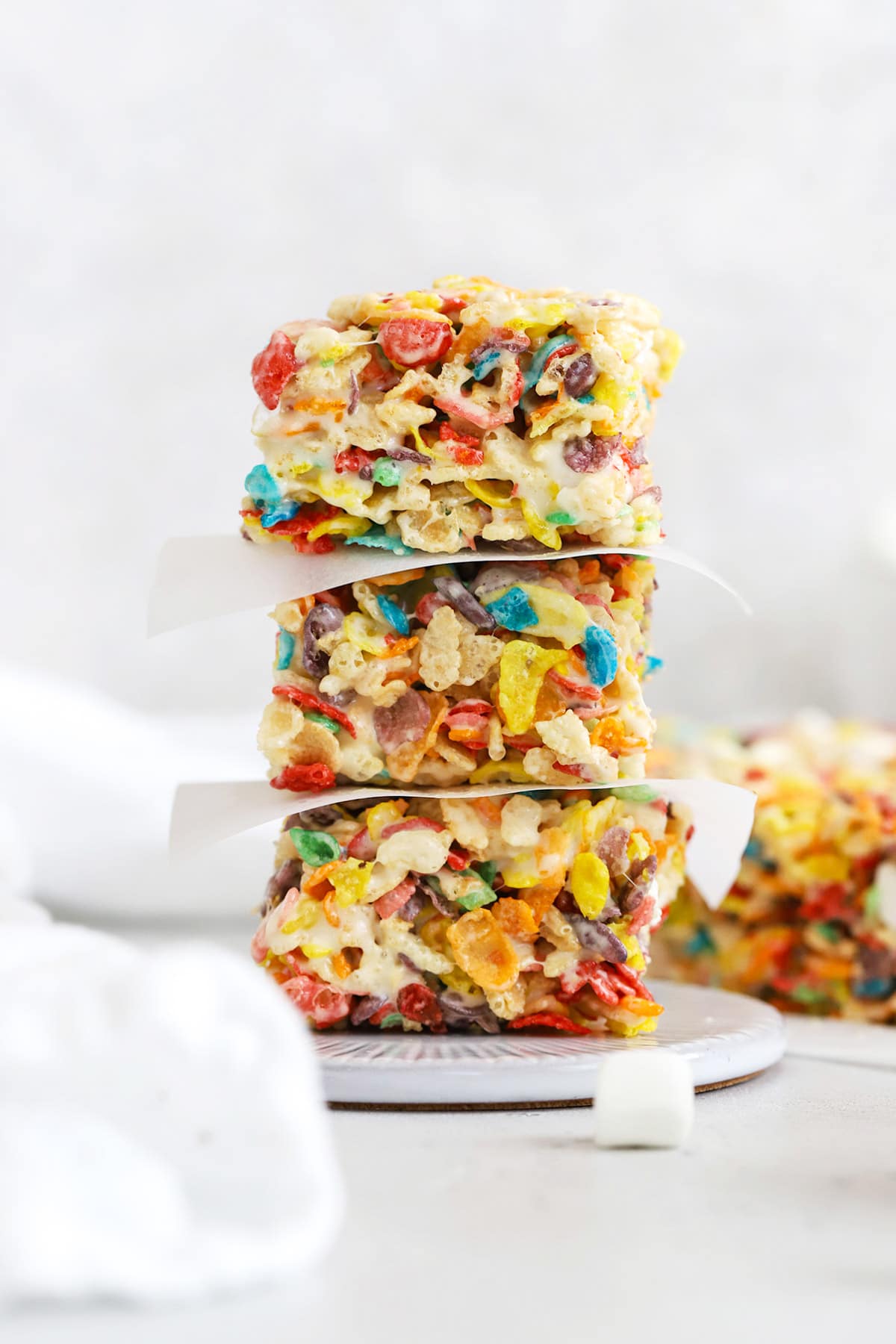 Front view of three fruity pebbles treats stacked on top of each other