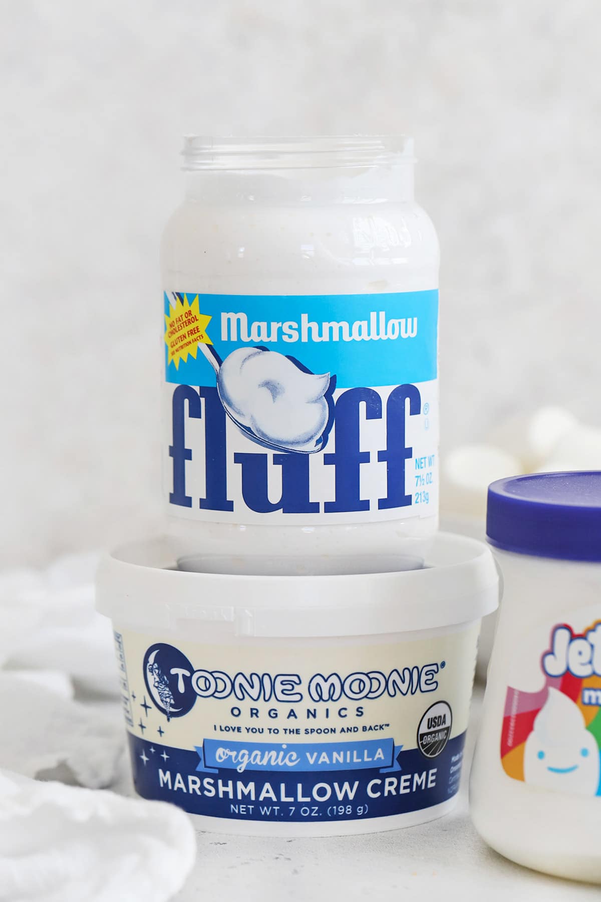 Front view of three brands of gluten-free marshmallow fluff/marshmallow creme