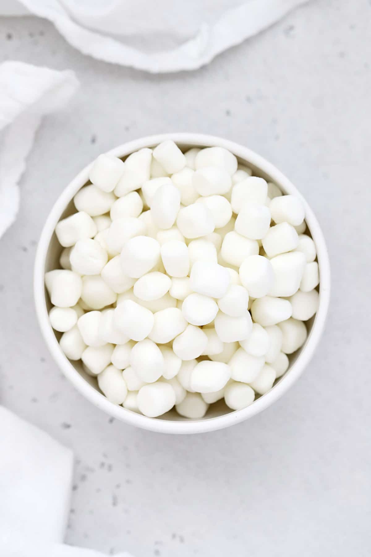 Overhead view of a bowl of mini marshmallows