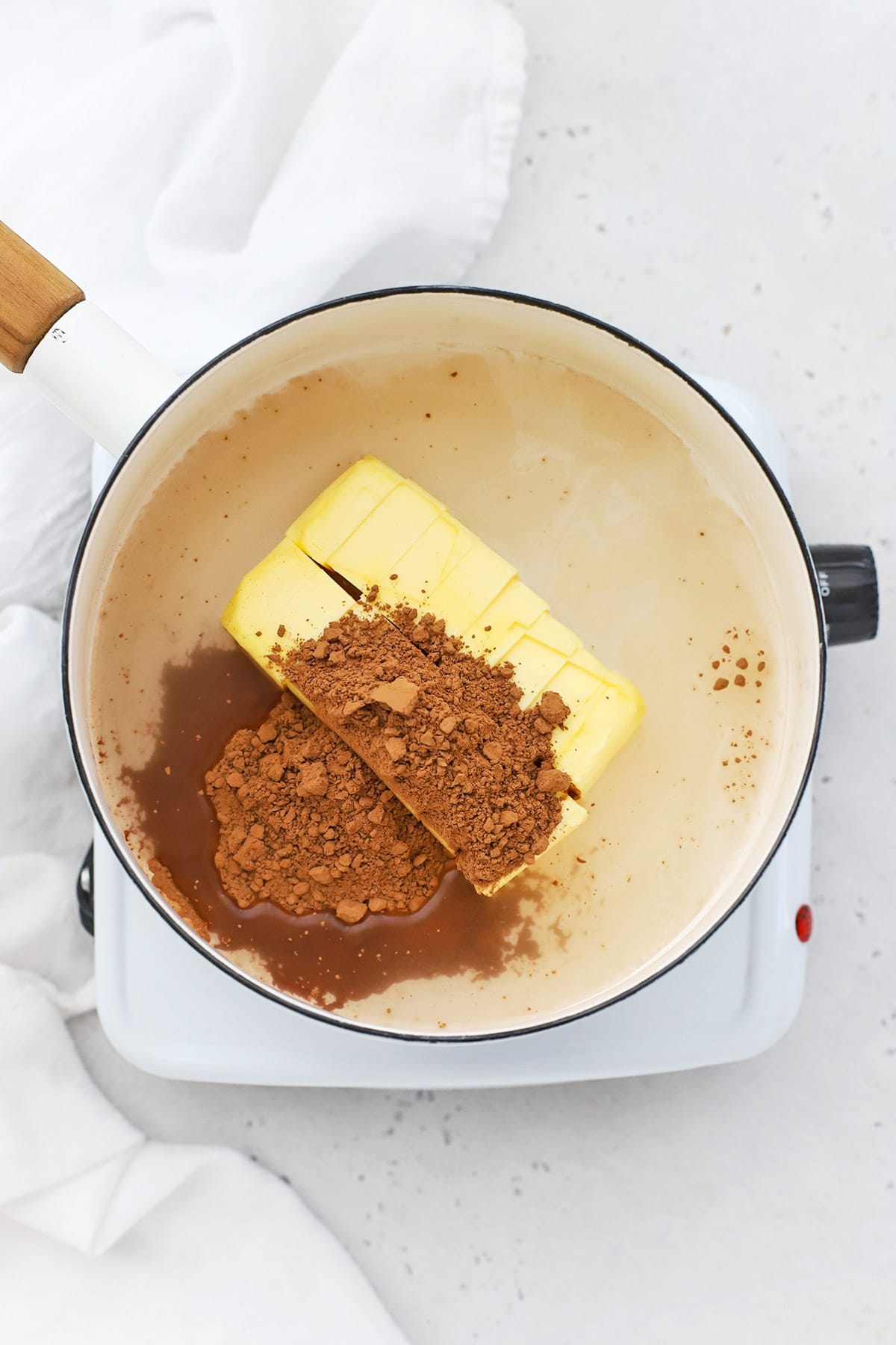 melting cocoa powder, butter, and water to make gluten-free texas sheet cake