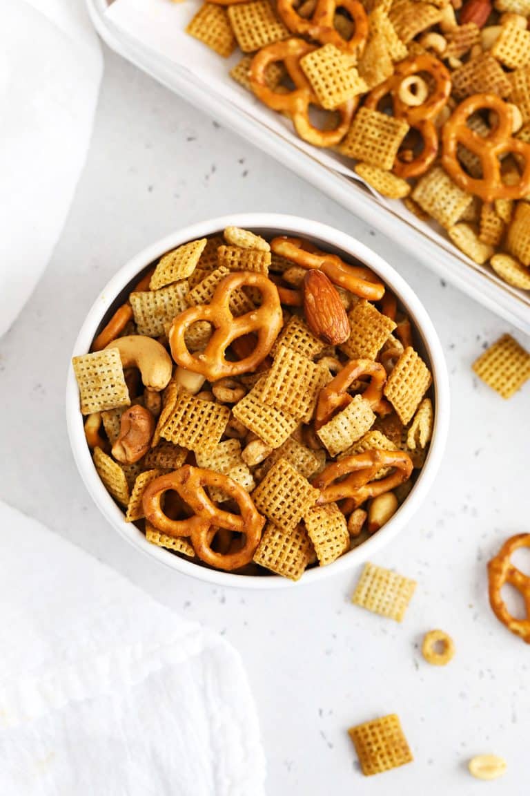 Overhead view of a bowl of easy gluten-free Chex Mix on a white background
