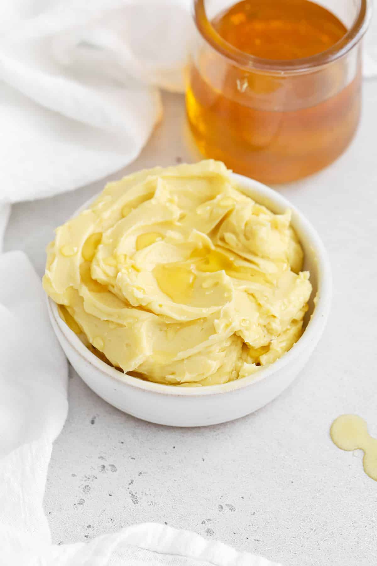 Front view of whipped honey butter drizzled with honey