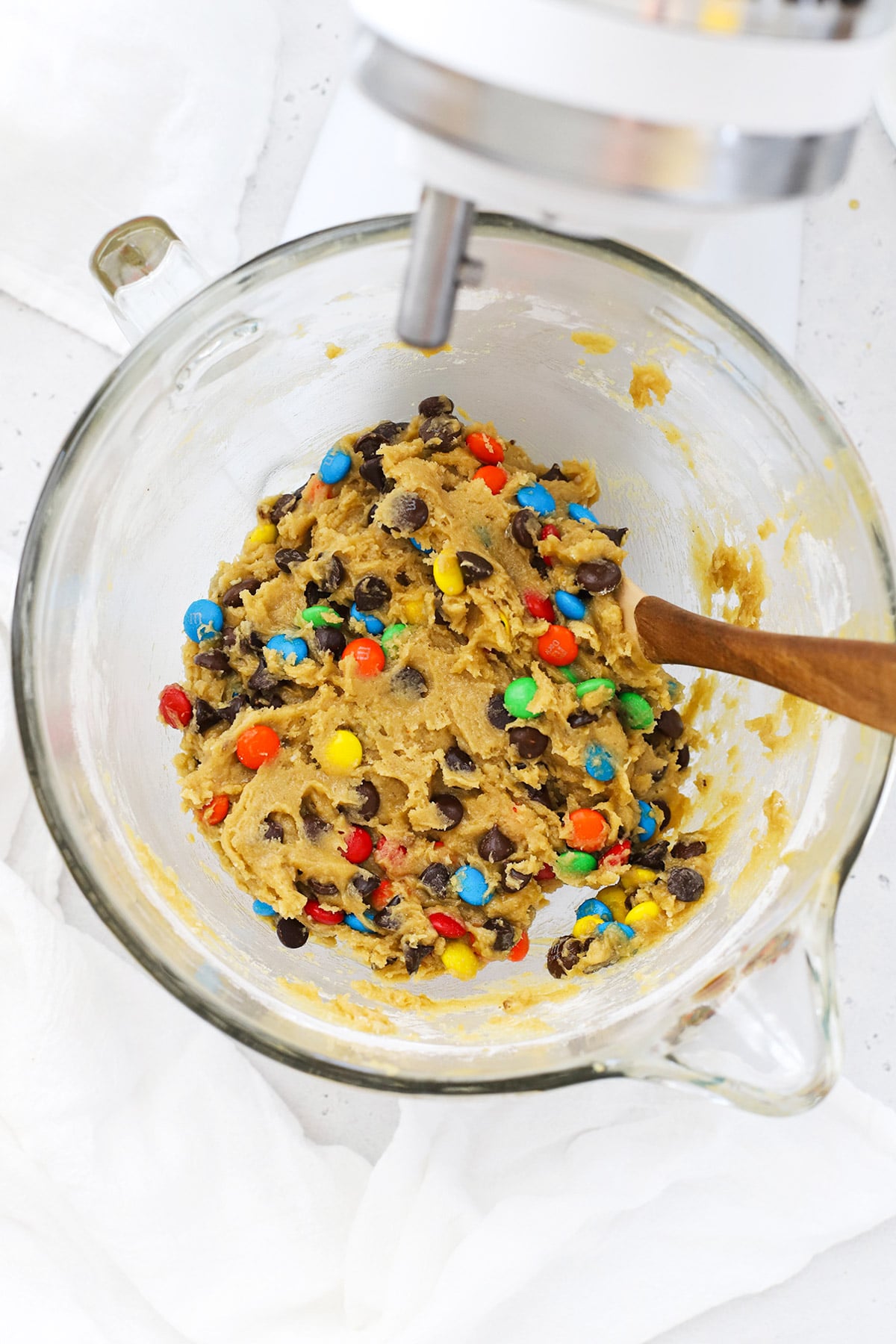 Adding M&Ms and chocolate chips to gluten-free m&m cookie dough