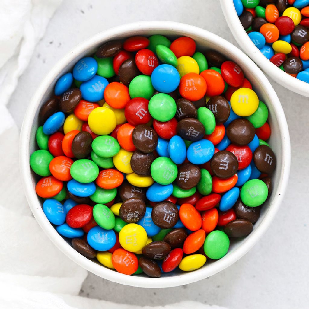 overhead view of a bowl of colorful m&ms