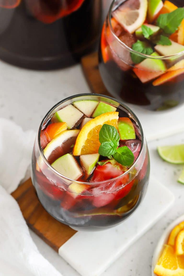 Overhead view of a glass of non-alcoholic sangria with fresh fruit