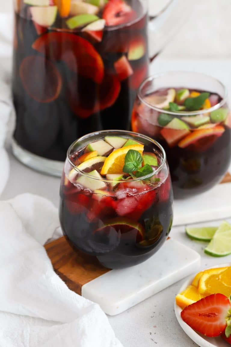 front view of two stemless glasses of non-alcoholic sangria