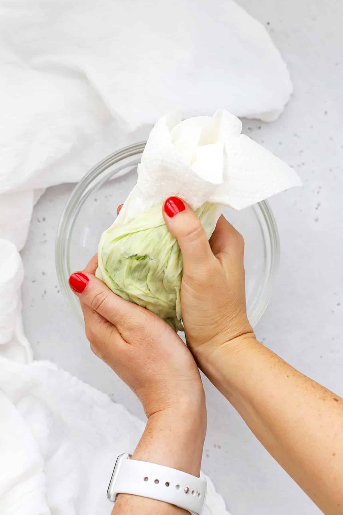 Squeezing extra liquid out of shredded zucchini to make gluten-free zucchini muffins