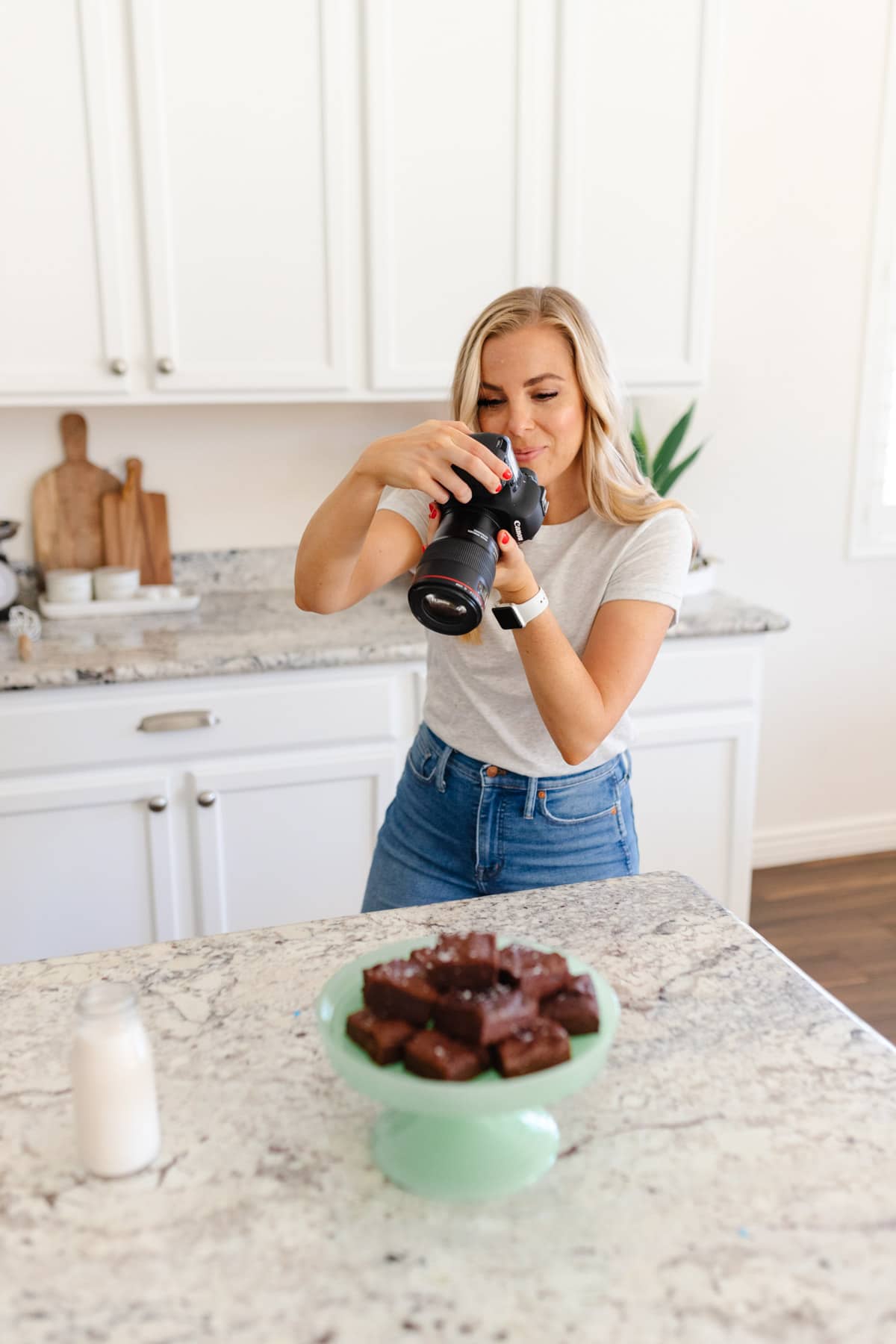 Emily Dixon from Sweets And Thank You Blog Photographing a stack of brownies