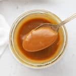 Scooping a spoonful of easy caramel sauce