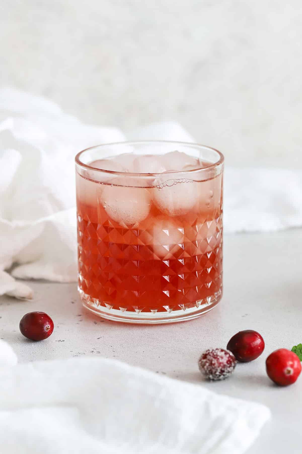 Front view of a cranberry mocktail made with mint simple syrup