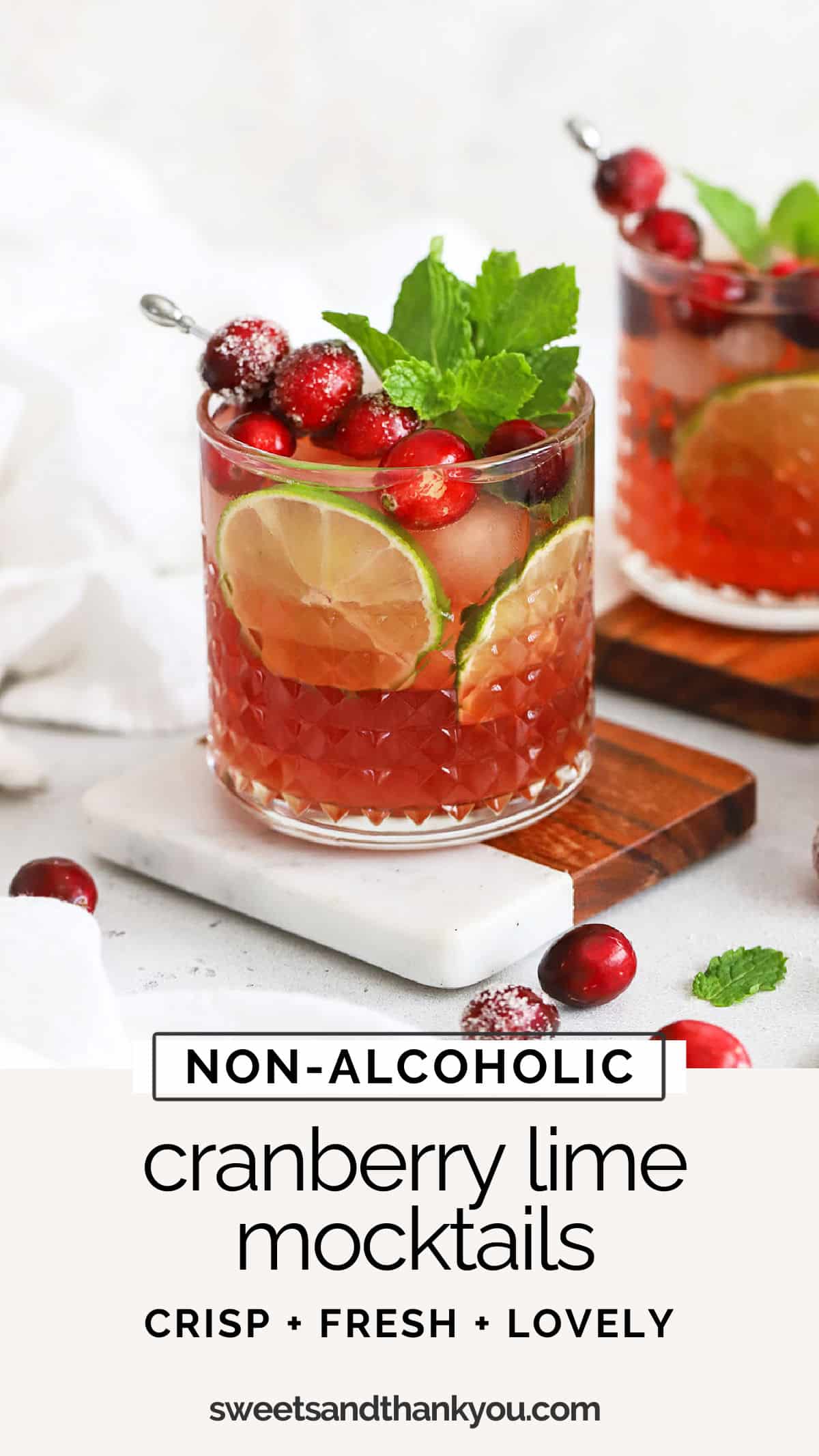 Cranberry Lime Mocktail - This non-alcoholic cranberry mocktail recipe is an easy holiday drink everyone can enjoy! // holiday mocktail recipe // christmas mocktail recipe / thanksgiving mocktail recipe / virgin cranberry mocktail / cranberry mocktail / winter mocktail recipe / red mocktail / red and green mocktail / mocktail with mint simple syrup / cranberry mint drink / non alcoholic cranberry lime cocktail / non alcoholic cranberry cocktail