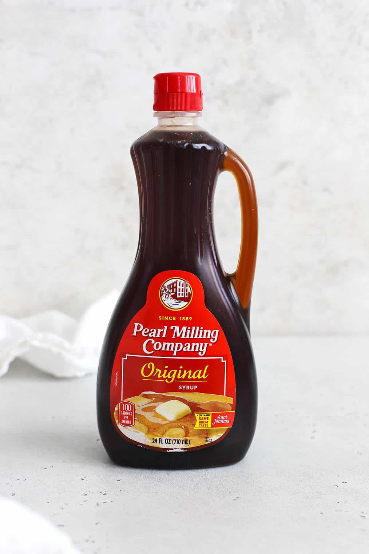 Front view of a bottle of Pearl Milling Pancake Syrup