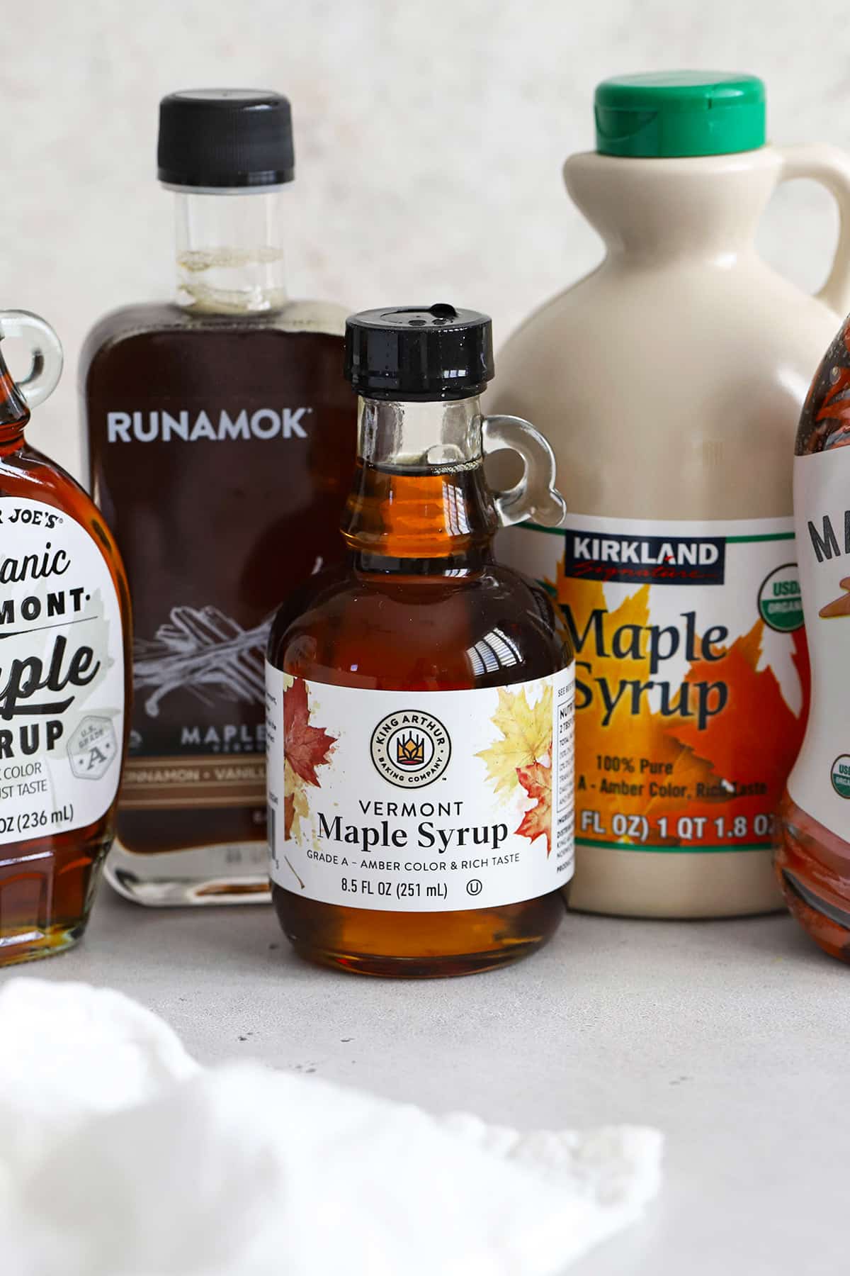 Front view of bottles of pure maple syrup