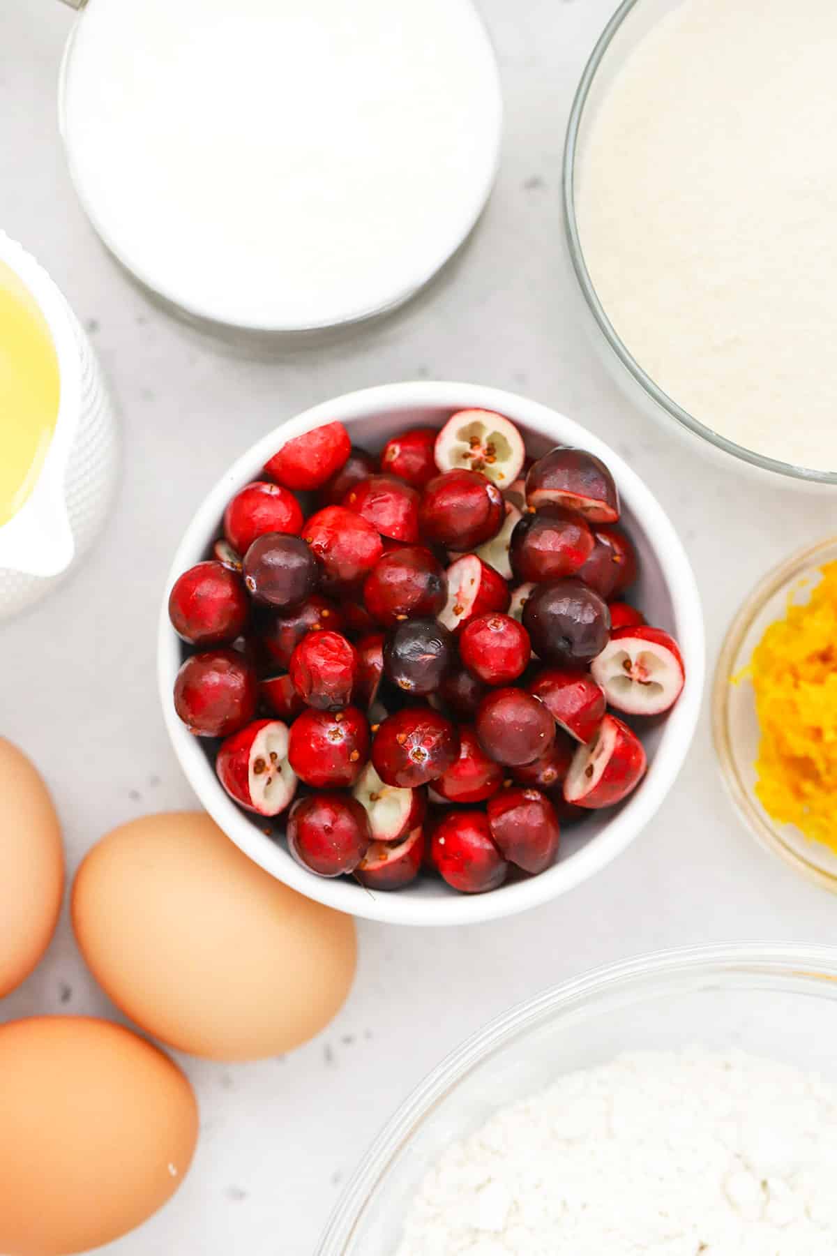 Overhead view of ingredients for gluten-free orange cranberry cake