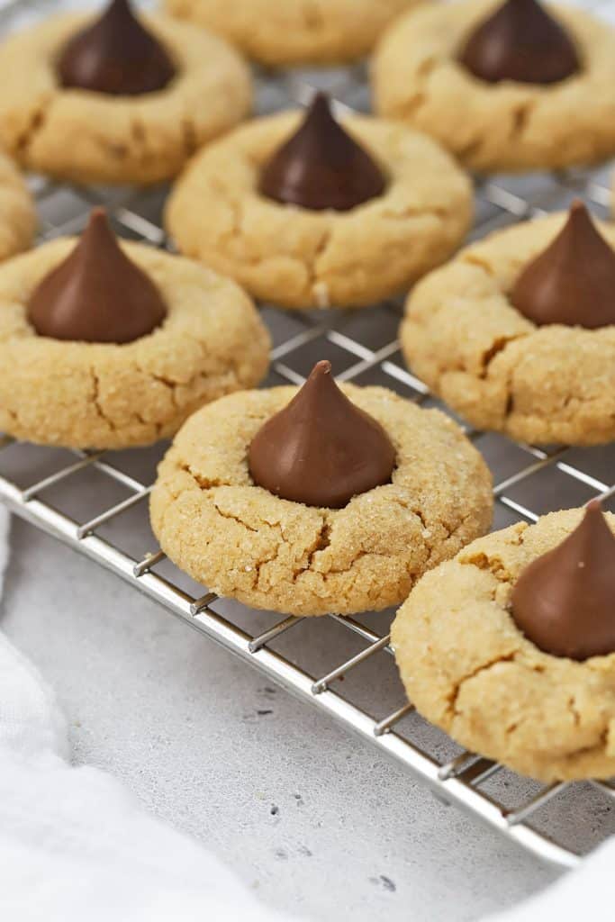 Gluten-free peanut butter blossoms cooling on a wire rack