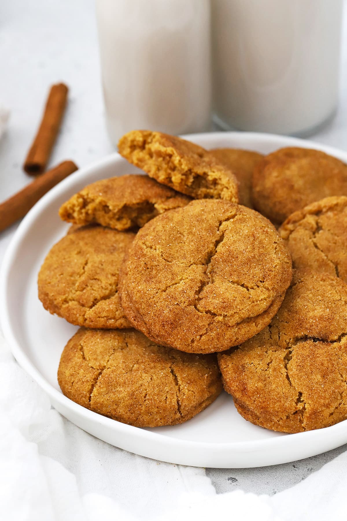 Front view of gluten-free pumpkin snickerdoodles on a white plate